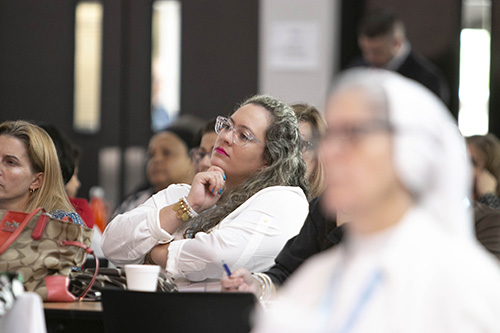 Participants listen to the keynote talk by Sister Miriam James Heidland of the Sisters of Our Lady of the Most Holy Trinity, during the archdiocesan Evangelization Summit, March 16, 2019, at Msgr. Edward Pace High School in Miami Gardens.