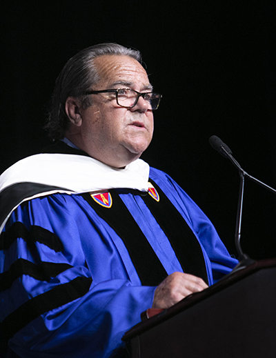 John J. Dooner, a 1970 alumnus who now chairs the Board of Trustees of St. Thomas University, speaks at the inauguration of David A. Armstrong as the school's 10th president, March 20, 2019.