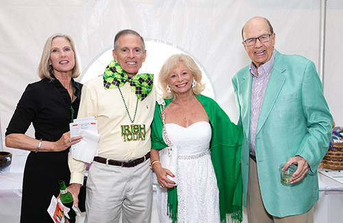 Martha and Tony Nicolli, along with Pam and Bob Sigda, enjoy the annual Joe-Paddy Festival held March 14 on the grounds of St. Vincent de Paul Regional Seminary in Boynton Beach.