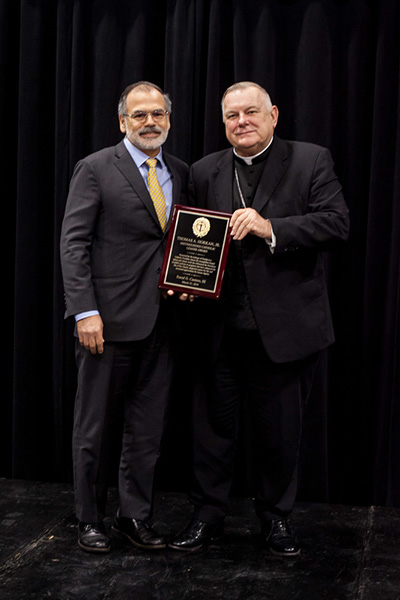 Archbishop Thomas Wenski presents Raoul G. Cantero, III, former Florida Supreme Court Justice and a Coral Gables resident, with the Thomas A. Horkan, Jr. Distinguished Catholic Leader Award.