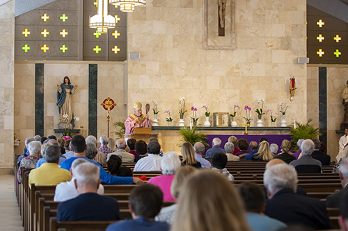 Archbishop Thomas Wenski gives the homily during the Mass celebrating the 60th anniversary of St. Pius X Church in Fort Lauderdale.