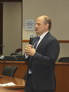 Florida Senator Jose Javier Rodriguez attended the climate conference at St. Thomas University wearing galoshes to emphasize the need for his colleagues in the legislature to protect against and plan for climate change.