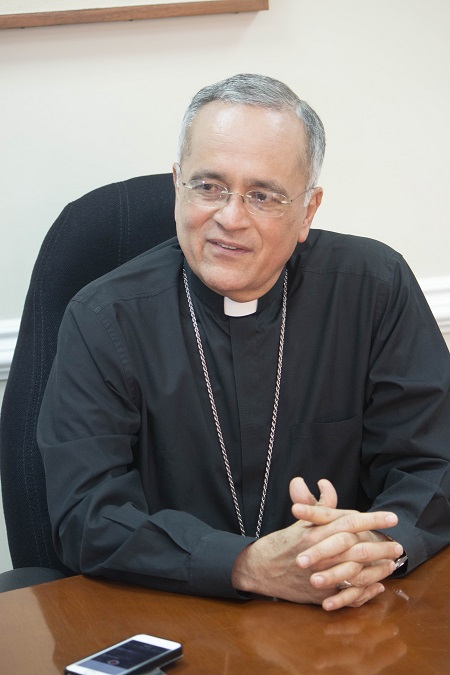 Managua Auxiliary Bishop Silvio Báez is interviewed April 26 by Rocio Granados of La Voz Catolica. He has just visited with Archbishop Thomas Wenski during a stop in Miami before traveling to Rome, where he has been called by Pope Francis after a series of death threats.