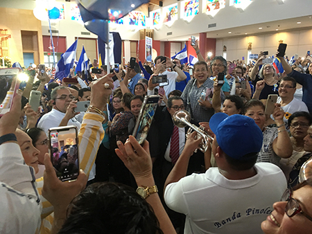 Accompanied by a Nicaraguan band, the faithful sing Happy Birthday to Managua Auxiliary Bishop Silvio Báez at the conclusion of the Mass at St. Agatha, April 28.