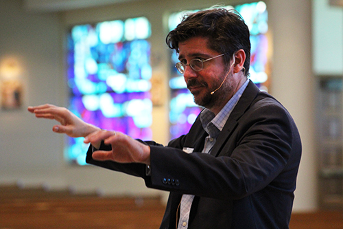 Richard Robbins, guest conductor at the American Federation Pueri Cantores Miami Choral Festival and Mass at St. Bonaventure Church, Davie, directs students during rehearsal March 30.