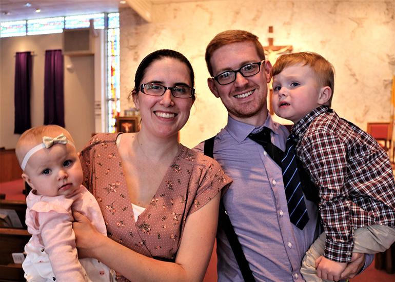 Christopher and Kristin Booty attend Mass at Blessed Sacrament Church in Oakland Park with their babies, Catherine and Maythan. The family are Muslims and are converting to Catholicism. They will all be baptized during the Easter Vigil.