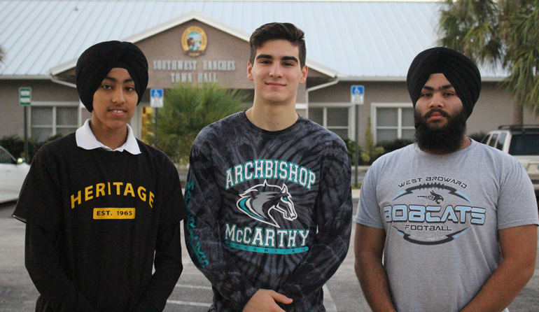 A town, two Sikhs, and a Catholic: Pavitpaul Singh, Nikolas Garcia and Jashanpreet Singh stand outside of Southwest Ranches town hall after meeting to discuss the Unity in Diversity 5K race.