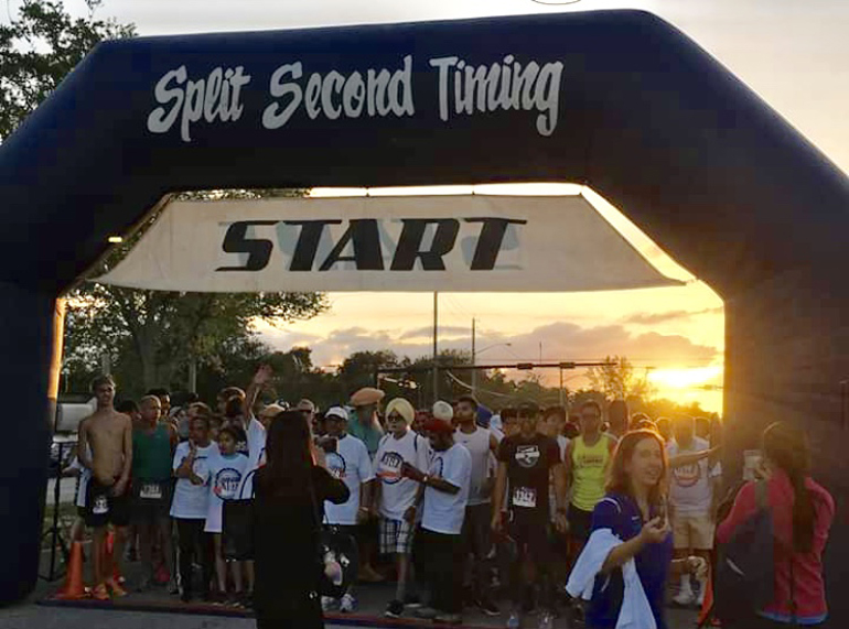 Runner's at the ready: Participants of the Unity in Diversity 5K race eagerly await at the starting line.