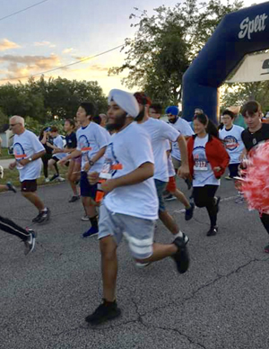 And they're off: Runners and walkers head out from the starting line at the Unity in Diversity 5K race held March 30 in Southwest Ranches.