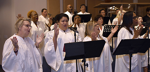 Choir sings praise and worship songs for Mass before a mortgage-burning celebration at St. Edward Church.