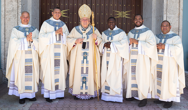 Archbishop Thomas Wenski poses with the newly ordained priests, from left: Father Elkin Sierra, Father Yonhatan A. LondoÃ±o, Father Reynold Brevil, Father Jose Enrique Lopez and Father Martin Munoz.

At a standing-room only St. Mary Cathedral, nearly 1,000 people witnessed the joyous, tradition-filled Mass of ordination for five new priests for the Archdiocese of Miami, May 11, 2019.