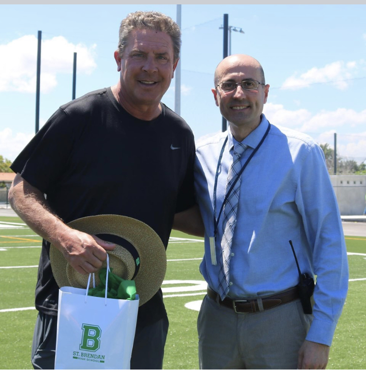 Miami Dolphins' legendary quarterback and NFL Hall of Famer Dan Marino stopped by St. Brendan High School May 21 to check out the new football and baseball fields. He also learned about the school's football program, which is just starting its second season. The new fields just had lights installed for night games, which means Friday Night Lights are coming to Westchester! Marino is pictured here with St. Brendan's principal, José Rodelgo-Bueno.