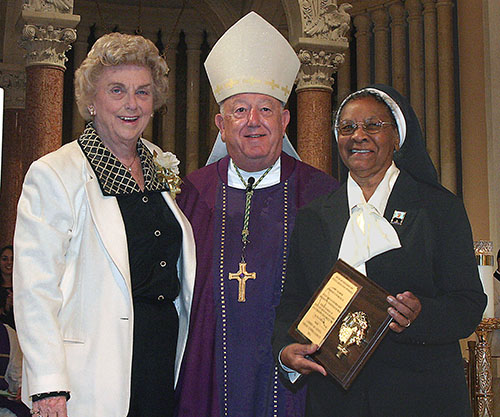 Marjorie Wessel, president of the Catholic Educators Guild, poses with Archbishop John C. Favalora and Sister Clementina Givens of the Oblate Sisters of Providence, recipient of the 2005 Lumen Christi award from the guild.