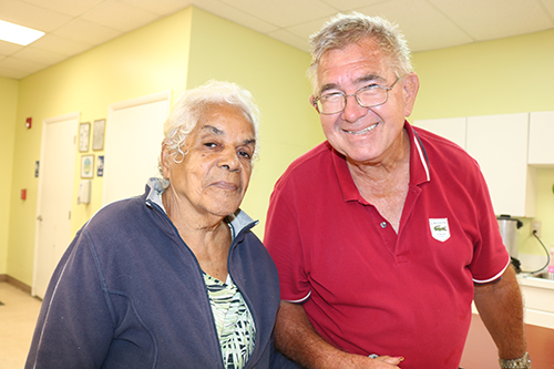 Brent Bradey walks hand in hand with his friend Delia Gonzalez, 88. He brings his friend to Centro Oeste Adult Day Care Center during the week. The center is operated by Catholic Charities. Programs at the center are for Spanish-speaking clients. "She is more active in conversation since she has been coming the the center," said Bradey. He said that he is thankful for the Catholic Charities' outreach. "She would have to go to a home if the center was not available," he said.