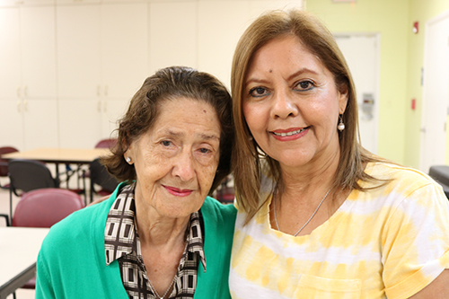 Maria Soto, 94, is shown with her daughter Clara Chavarri as she arrives at Catholic Charity's Centro Oeste Adult Day Care Center in Davie. Chavarri spoke very highly of the center saying that the ministry is a big help to her family, and her mother has  has met friends and enjoys the company and the program activities that the center offers. "It is a very good place. She can't be left alone. I feel like she is safe here."