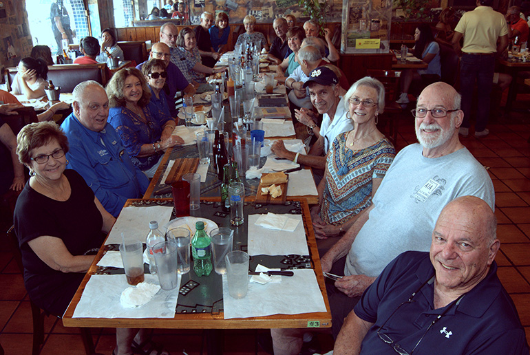 Alumni of Sts. Peter and Paul School gather for lunch in Miami during their 70th anniversary reunion.