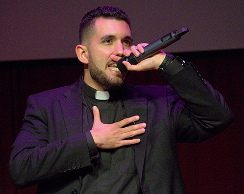 Michael Martinez, studying for the priesthood with the Society of Jesus, gives a rap during TEDx, a recent forum of speeches and performances at St. Thomas Aquinas High School in Fort Lauderdale.