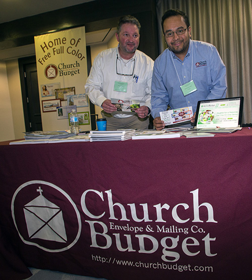 Brooke Pidgeon and Heriberto Pimentel pose at the Church Budget electronic giving display. They were among the exhibitors at the second Florida Statewide Stewardship Day, held May 4, in downtown Miami.