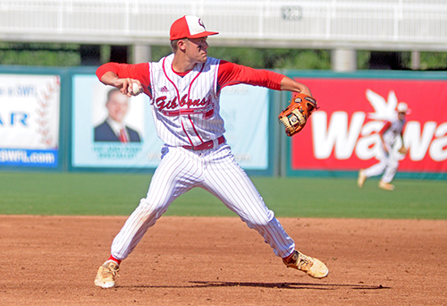 Cardinal Gibbons shortstop Trevor Kole throws out a Melbourne Central Catholic hitter during the fourth inning of their Florida Class 5A baseball state championship game May 30.