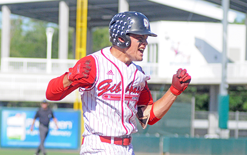 Cardinal Gibbons' Trevor Kole celebrates his fourth-inning triple against Melbourne Central Catholic in their Florida Class 5A baseball state championship game May 30.