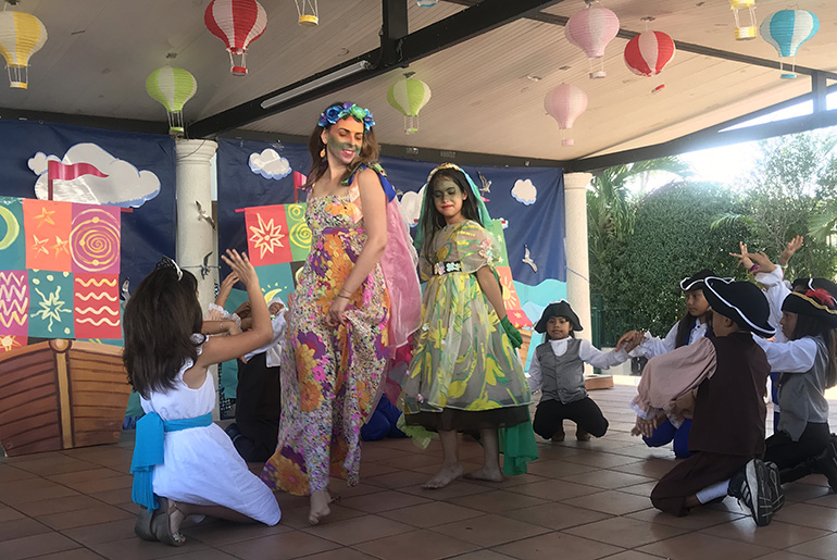 Children from Centro Mater's theater program surround Ingenio Teatro's Rocio Alvarez during a performance of "Legends of Discovery," a play which centers on the discovery of America. The local theater company and child care center have been working together for over two years.