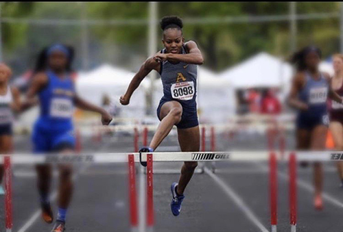 St. Thomas Aquinas' Emelia Chatfield set a state-meet record in the 300 hurdles in 41.34, just off the state-best 41.15 she ran in regionals.