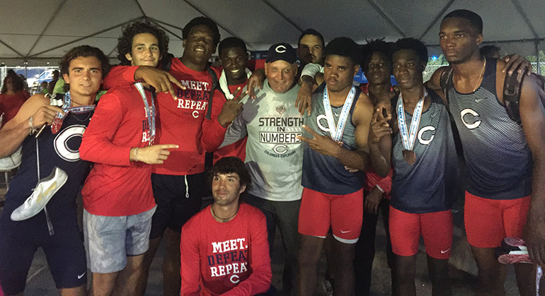 Columbus' track and field team, shown here with coach Fred Foyo, repeated as Florida Class 4A champions. Foyo was named Co-Coach of the Year for track and field for the second consecutive year by the Miami Herald.