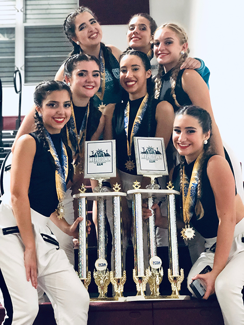 Archbishop McCarthy High School's small varsity jazz and hip hop squad is pictured here with the first place trophy they earned at the Florida Cheer and Dance Association's Miami Meltdown competition in February.