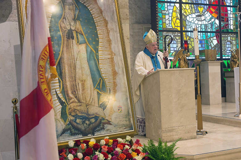 Archbishop Thomas Wenski delivers the homily during the Mass of consecration for the Village of Key Biscayne.
