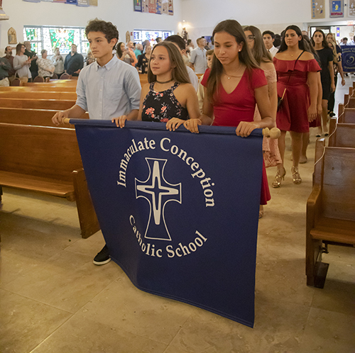 Students from Immaculate Conception School process into St. Agnes Church, Key Biscayne, for the All Catholic Conference All Star Mass.