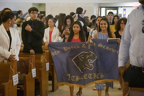 Students from Sts. Peter and Paul School process into St. Agnes Church, Key Biscayne, for the All Catholic Conference All Star Mass.