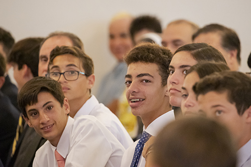 Students from Blessed Trinity School listen attentively to Father Juan Carlos Paguaga's homily during the All Catholic Conference All Star Mass held at St. Agnes Church, Key Biscayne.
