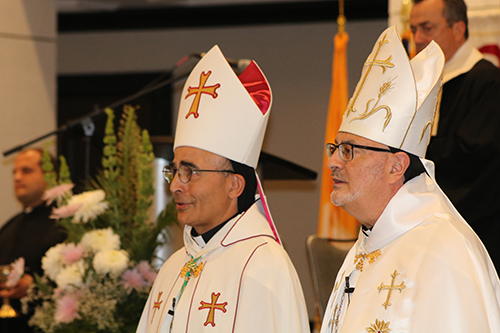 The two bishops of the U.S. Maronite Catholic Church celebrate Mass or the Divine Liturgy during the Maronites' national convention held in Miami Beach June 26-30. Bishop Abdallah Elias Zaidan, left, eparch of Our Lady of Lebanon of Los Angeles, and Bishop Gregory John Mansour, eparch of St. Maron of Brooklyn, are shown in a procession as Mass began June 27, gathering convention participants and more than 100 clergy.