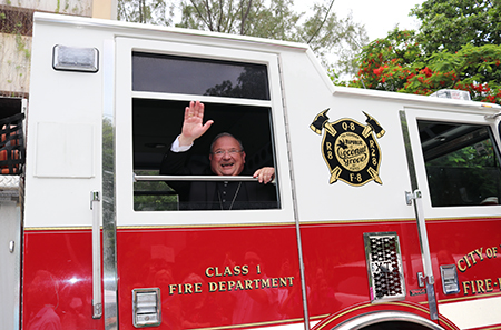 After Sunday Mass June 30, Bishop Peter Baldacchino got a surprise. Parishioners had arranged for him to ride on a fire truck.