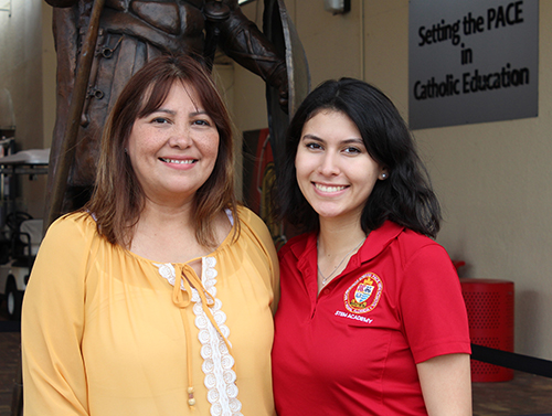Msgr. Edward Pace High graduate Vanessa Perez Robles poses with her mother, Yibis Robles, at the plaza at Pace. Despite financial struggles, Yibis taught her daughter to study and work hard for her future, a path that has led her to be awarded an Amazon Future Engineer scholarship and internship, and a full ride to Ivy League school, Dartmouth College.