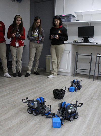 Girls in control: Members of the Women in STEM (Science, Technology, Engineering and Math) Club at Pace work together on a robotics exercise. From left: rising seniors Kaylee Gonzalez, Guadalupe Diaz, and 2019 grad Vanessa Perez Robles.