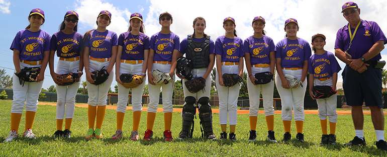 Pictured, from left, are the members of St. Michael the Archangel School's softball team, which finished the season undefeated: Samantha Archila, Nadesha Almonte, Sofia Leyva, Lorena Gonzalez, Emily Barrera, Sabrina Fernandez, Britney Duran, Caroline Fortun, Kiara Vega, Julieta Infante, and Coach Jose "Pepe" Hernandez.