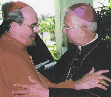 Cardinal Jaime Ortega, left, embraces Miami's then Auxiliary Bishop Agustín Román during the Cuban prelate's visit to the National Shrine of Our Lady in Miami the spiritual center of Cuban exile.