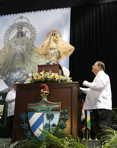 Rogelio Zelada oversees the removal of the image of Our Lady of Charity from its protective urn at the start of the annual celebration for Cuba's patroness, Sept. 8, 2015.