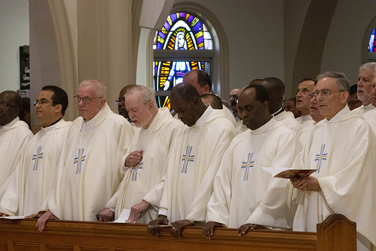 Archdiocesan priests take part in the annual chrism Mass, April 16, 2019.