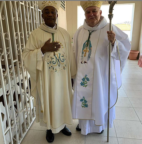 Archbishop Thomas Wenski poses with Cap Haitien Archbishop Launay Saturné before celebrating Mass there on the feast of the Assumption, patroness of the Haitian archdiocese.