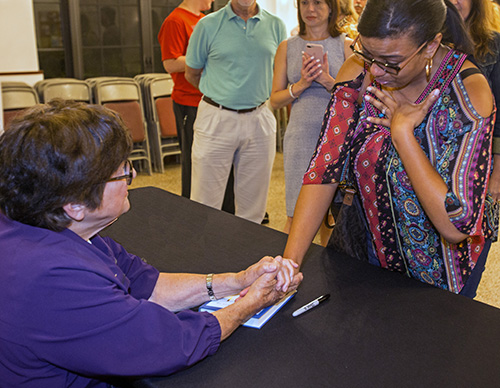After her talk, Sister Helen Prejean consoles Melissa Bouie, whose uncle is on death row in Missouri.
