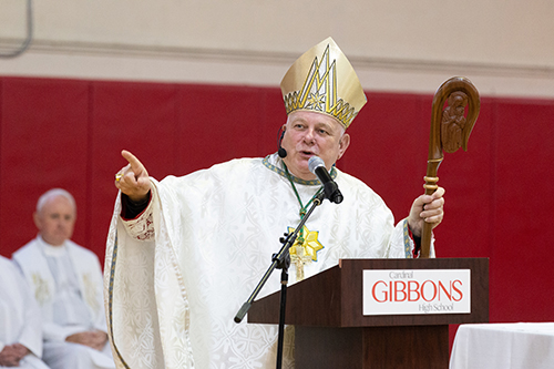 Archbishop Thomas Wenski delivers the homily while celebrating Mass for the opening of the school year at Cardinal Gibbons High School Aug. 22, feast of the Queenship of Mary.