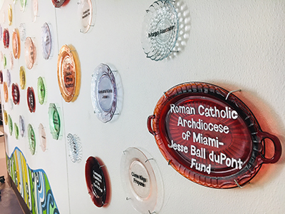 The recognition wall at the SOS Callahan Community Kitchen notes the contribution of the Archdiocese of Miami, which facilitated a grant from the Jessie Ball Dupont Foundation. The kitchen is an expansion of the outreach programs sponsored by the Basilica of St. Mary Star of the Sea in Key West. Located behind Key West's city hall, the kitchen was dedicated in December 2018.