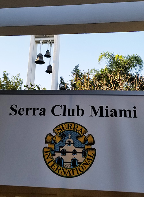 A Serra Club Miami banner is framed against the bell tower at St. John Vianney College Seminary in Miami in this file photo.
