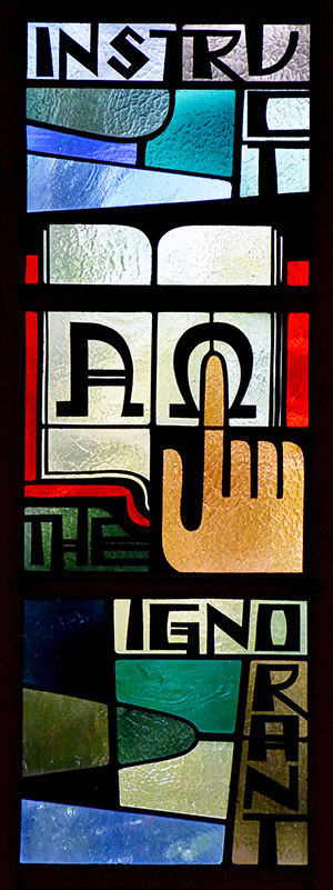 Windows along the side walls remind worshipers how to follow Jesus' commands. This one urges them to "Instruct the ignorant."