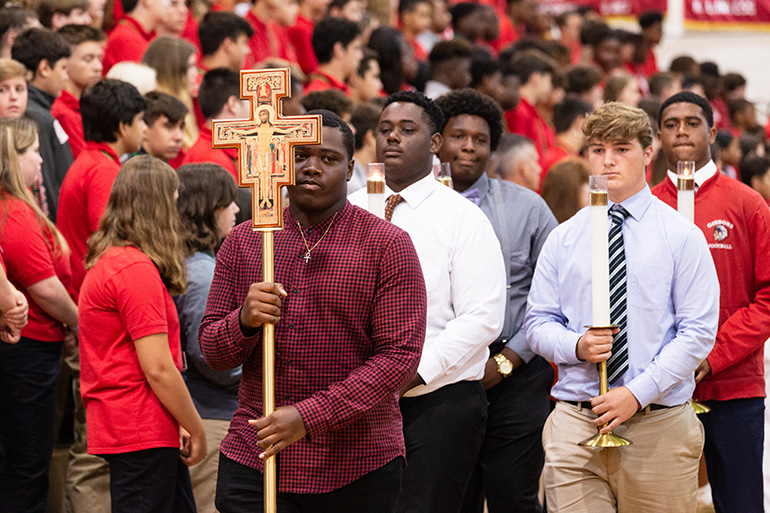 Members of the football team at Cardinal Gibbons High School in Fort Lauderdale helped organize the opening Mass for the beginning of the school year on Aug. 22.