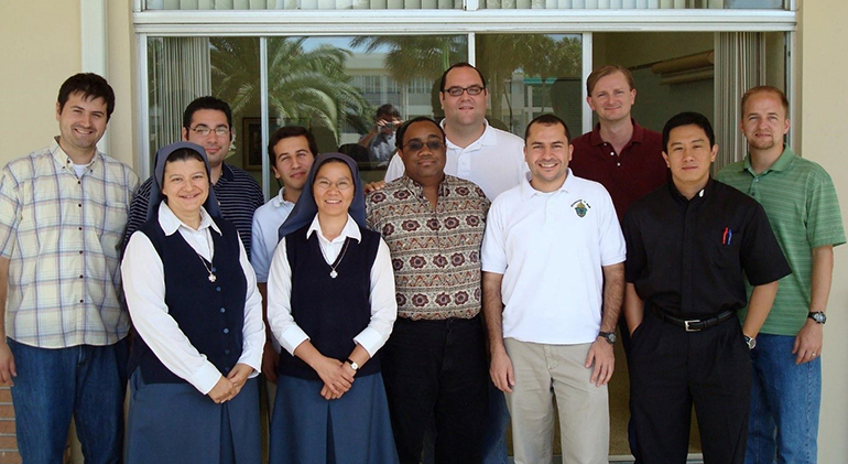 Participants in one of St. John Vianney College Seminary's pre-theology class with pose with Father Matias Hualpa, Matias Hualpa, dean of seminarians, second from right, front, and Father Ferdinand Santos, seminary rector, first from right, front.