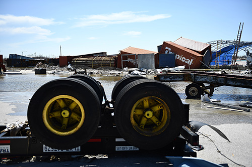 The wheels of a damaged truck lie upside down following Hurricane Dorian Sept. 5, 2019, in Marsh Harbor, Great Abaco.