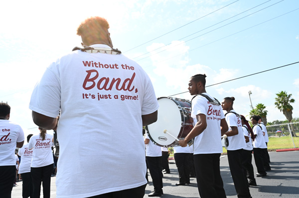 St. Thomas University's marching band makes its way to the field for the school's first game.